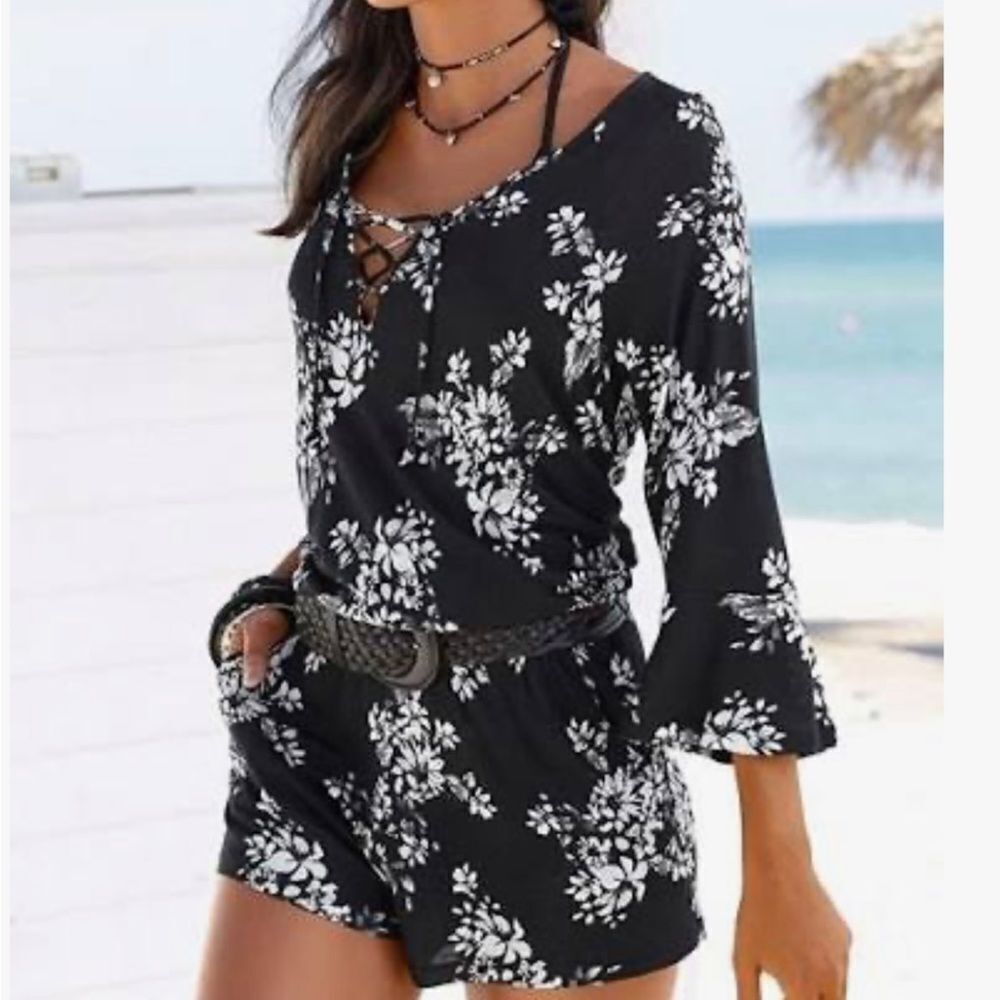 Misses size medium romper.  Dark navy with floral. One ❤️ clothing Los Angeles